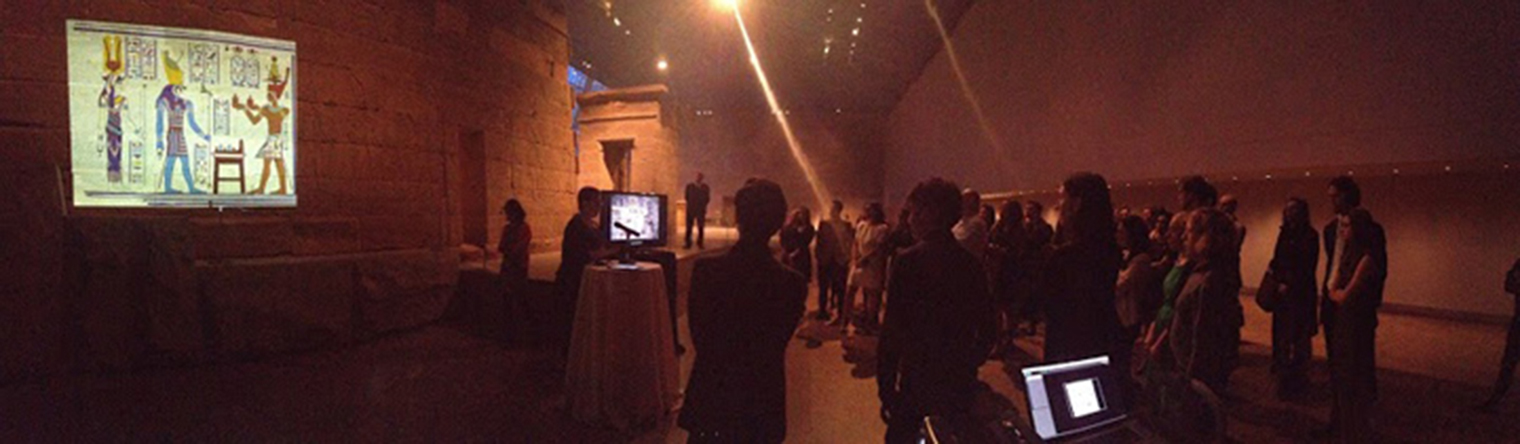 Gallery view of a vibrant scene projected on a wall of The Temple of Dendur