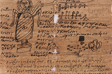An ancient papyrus fragment featuring greek text and a rough sketch of a robed figure, depicting a deity or mythological character, surrounded by various symbols and drawings.