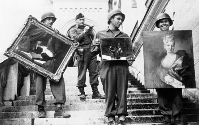 Soldiers carrying works of art