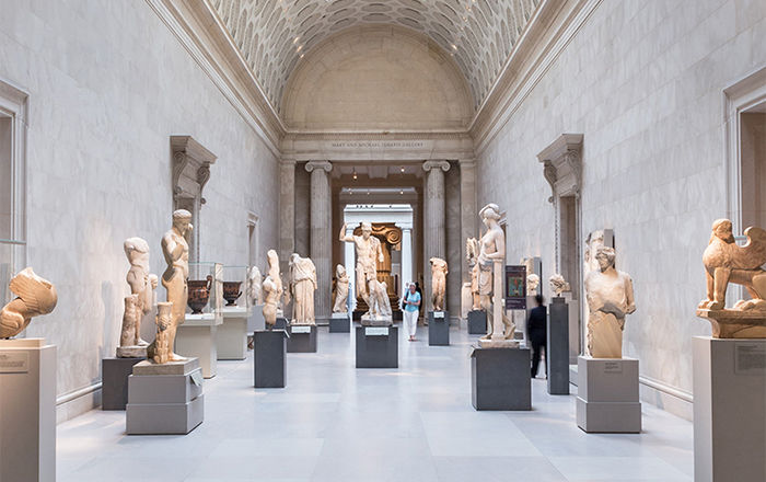 A view of The Met's Greek and Roman sculptures which line a sweeping hallway